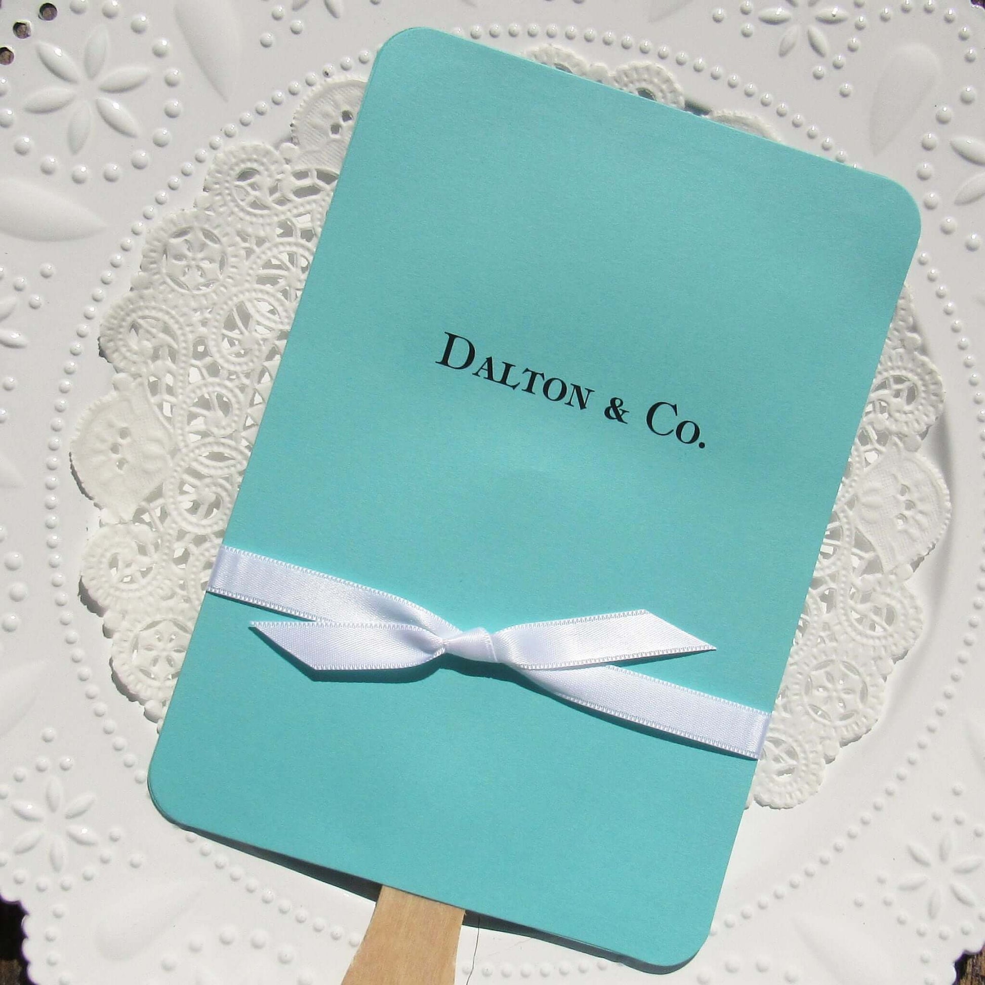 An elegant take on the hand fan , these Aqua Wedding Fans with Ribbon are sure to be appreciated on that hot sunny day.  Personalized with couples last name & Co.  White ribbon is included and comes attached.