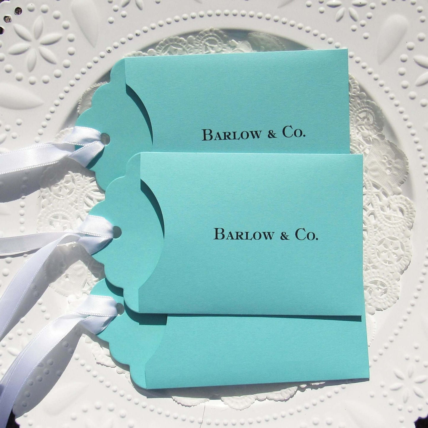 Aqua Blue Wedding Guest Favors personalized for the bride and groom.  Slide a lottery ticket in to see who wins big at your wedding.  Tiffany  blue wedding favors adorned with a white ribbon which comes attached.