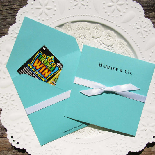 Eye catching and elegant, the distinctive design of these lovely Aqua Blue Wedding Favors are sure to compliment your wedding theme. Give your guests a chance to win big by enclosing a scratch off lotto ticket.