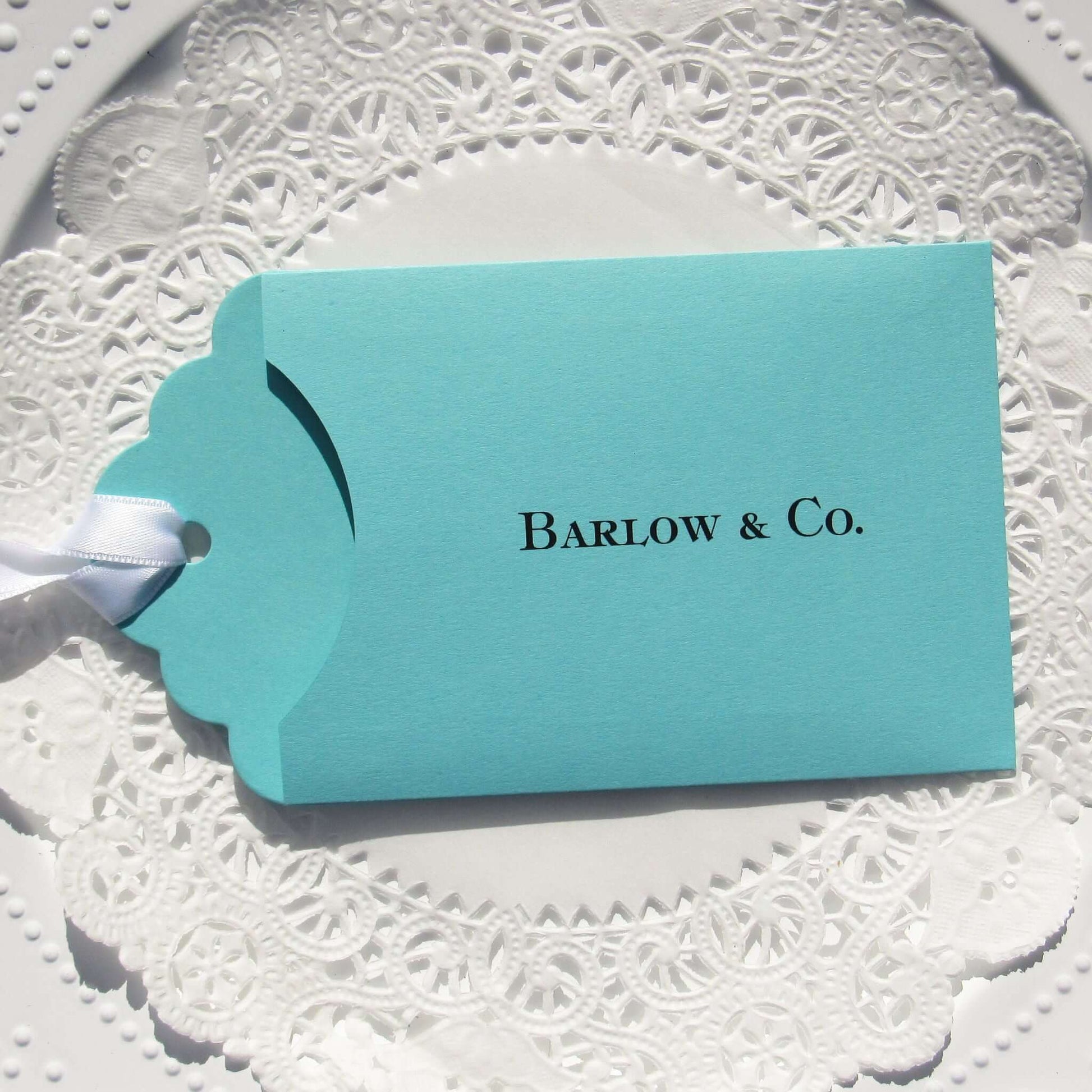 Aqua Blue Wedding Guest Favors personalized for the bride and groom.  Slide a lottery ticket in to see who wins big at your wedding.  Tiffany  blue wedding favors adorned with a white ribbon which comes attached.