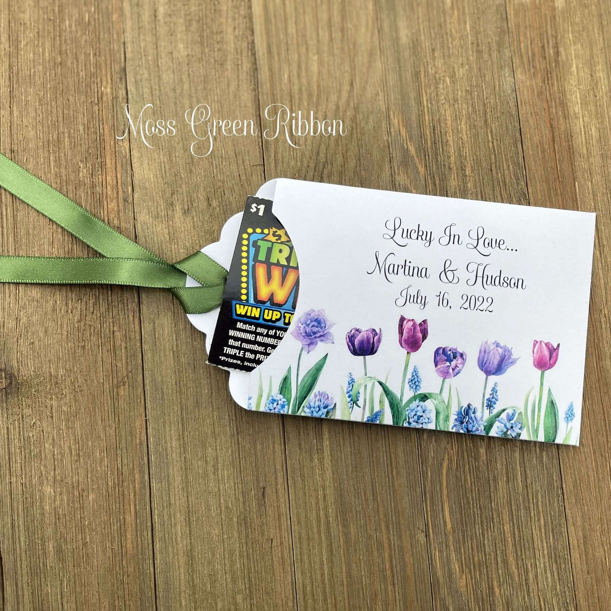 Tulip Wedding Reception Favors adorned with purple tulips these are so perfect for your spring wedding.  Envelopes are white with 'lucky in love' and the bride and grooms names and wedding date.  Ribbon included and comes attached.  Slide a lotto ticket in for a fun favor.