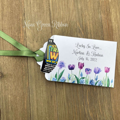 Tulip Wedding Reception Favors adorned with purple tulips these are so perfect for your spring wedding.  Envelopes are white with 'lucky in love' and the bride and grooms names and wedding date.  Ribbon included and comes attached.  Slide a lotto ticket in for a fun favor.
