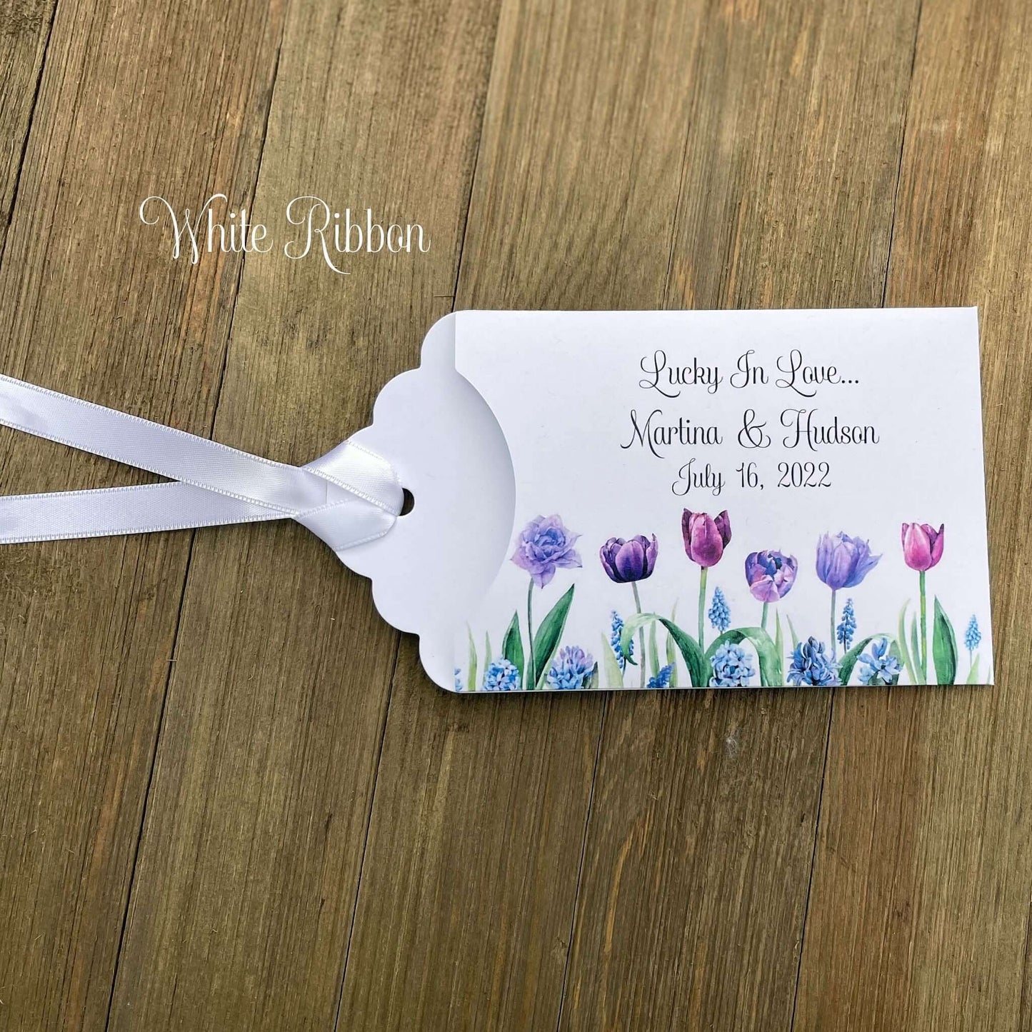 Tulip Wedding Reception Favors adorned with purple tulips these are so perfect for your spring wedding.  Envelopes are white with 'lucky in love' and the bride and grooms names and wedding date.  Ribbon included and comes attached.  Slide a lotto ticket in for a fun favor.