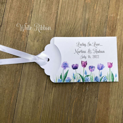 Tulip Wedding Reception Favors adorned with purple tulips these are so perfect for your spring wedding.  Envelopes are white with 'lucky in love' and the bride and grooms names and wedding date.  Ribbon included and comes attached.  Slide a lotto ticket in for a fun favor.