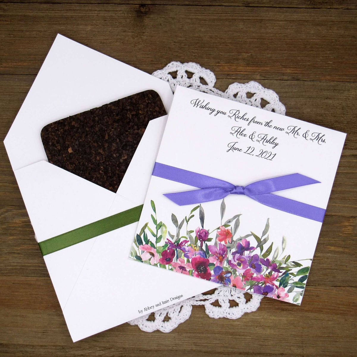 Purple Floral Wedding Guest Favors printed on white card stock with ribbon tied.  Personalized lottery ticket envelope favors, insert an instant lotto ticket for a fun guest favor.