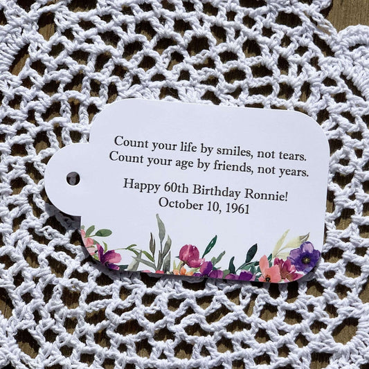 Wildflower Birthday Favor Tags, printed on white card stock and personalized for the guest of honor.  Adorned with purple flowers these can be tied on to what ever you choose.