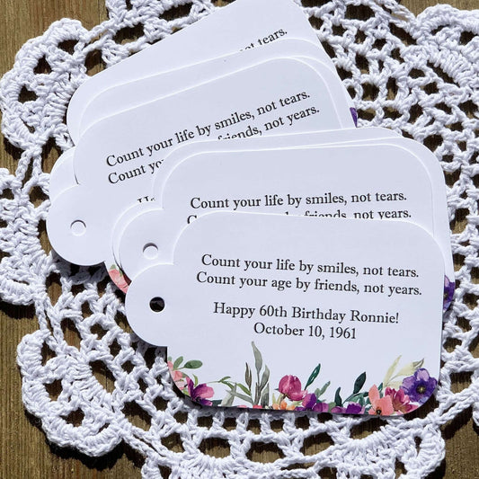 Wildflower Birthday Favor Tags, printed on white card stock and personalized for the guest of honor.  Adorned with purple flowers these can be tied on to what ever you choose.