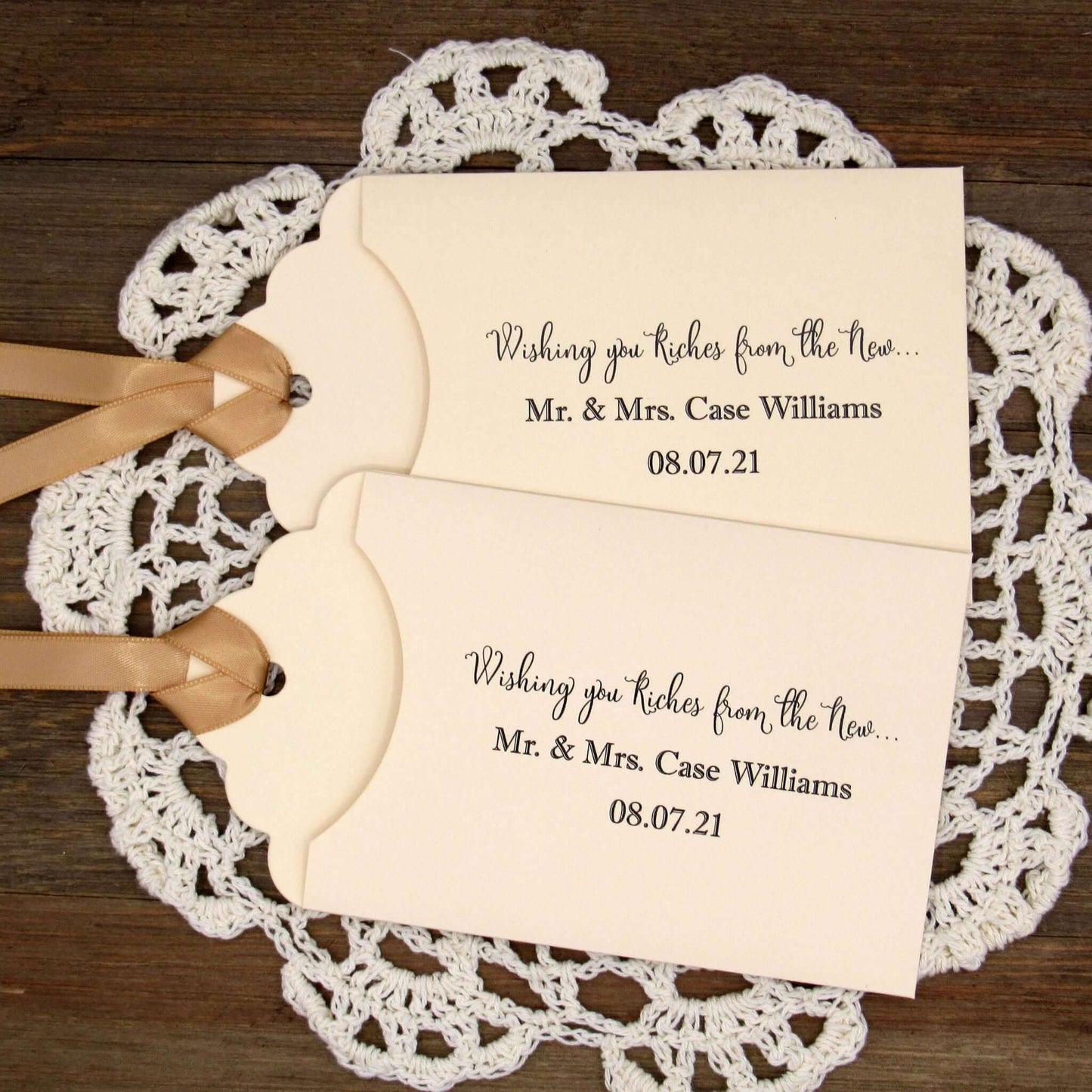 Personalized Lottery Ticket Wedding Favors, printed on card stock with ribbon attahced.  Each printed with 'Wishing you riches from the new Mr.  & Mrs.  Your choice of envelope and ribbon color.