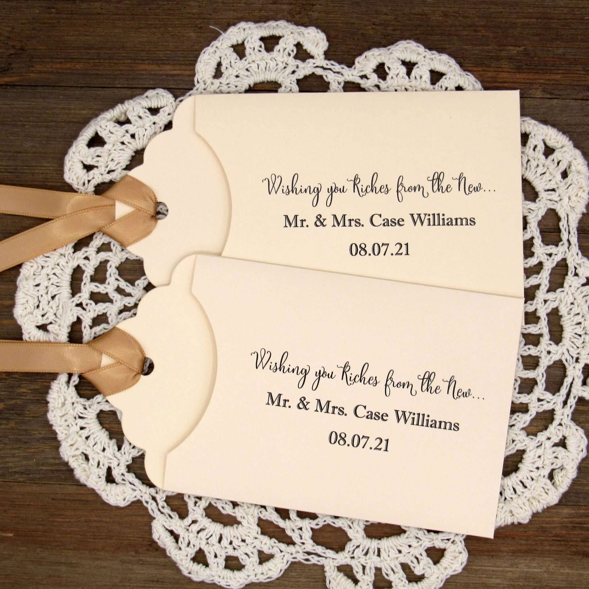Personalized Lottery Ticket Wedding Favors, printed on card stock with ribbon attahced.  Each printed with 'Wishing you riches from the new Mr.  & Mrs.  Your choice of envelope and ribbon color.