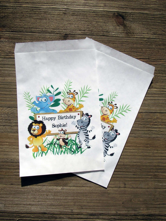 Zoo Birthday Party Favor Bags personalized for the guest of honor.  Printed on white bags adorned with cute zoo animals, these are perfect to fill with candy, popcorn, cookies or a goodie bag to take home.