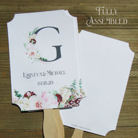 Monogram Wedding Fans, personalized for the bride and groom.  Large initial highlighted by pink and burgundy floral.  Fans ship fully assembled, 2 sided with hand hidden for a finished look.  Your choice of white, ivory or gray card stock.